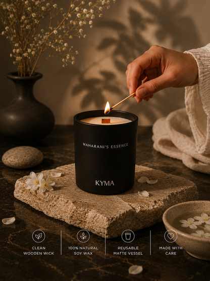 Hands lighting the Maharani's Essence soy candle
